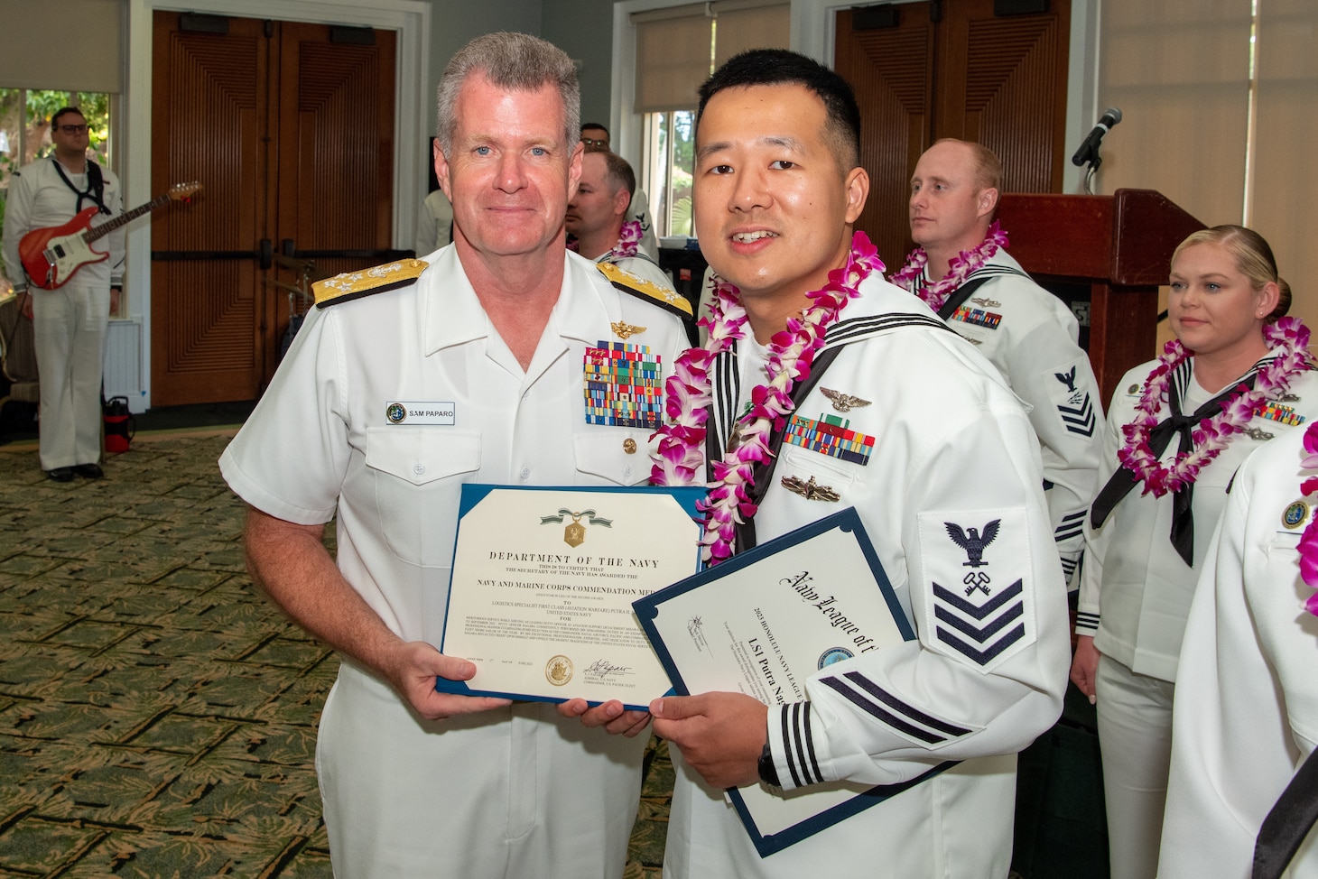 Adm. Samuel Paparo, commander of U.S. Pacific Fleet, poses for a photo with the Shore Sailor of the Year, Logistics Specialist 1st Class Putra Nagara. The SOY program, established in 1972, recognizes those who exemplify a warfighting spirit, the Navy’s core values, and a deep commitment to their commands and communities. (U.S. Navy photo by Mass Communication Specialist 1st Class Nick Bauer)