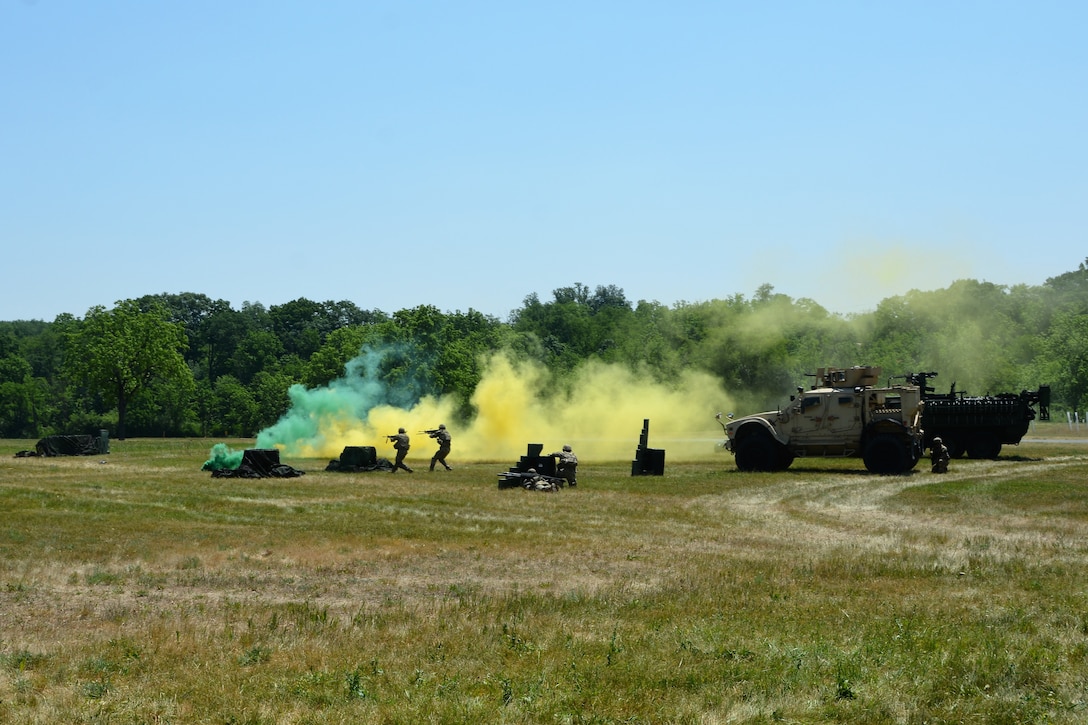 The Pennsylvania Army National Guard Ambassador Demonstration Team performs a live-action demonstration May 31, 2023, at Fort Indiantown Gap, Pa. The 15-member team was recently formed to travel across the state to different events to help raise awareness of the National Guard and aid recruiting. (Pennsylvania National Guard photo by Brad Rhen)