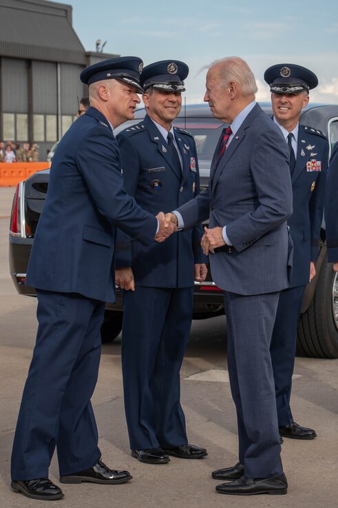  U.S. Space Force Col. David Hanson, commander, Space Base Delta 1, (left) greets U.S. President Joe Biden (right) upon his arrival at Peterson Space Force Base May 31, 2023. (U.S. Space Force photo by Emily Peacock)