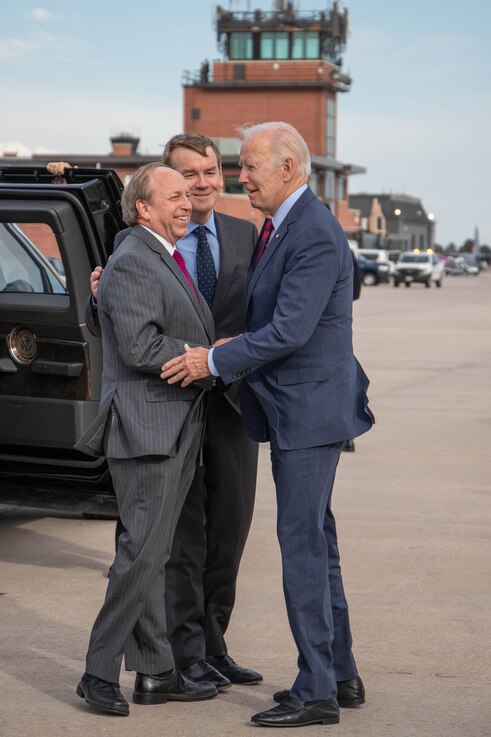  Colorado Springs Mayor John Suthers (left) and Senator Michael Bennet (center) welcome U.S. President Joe Biden May 31, 2023 at Peterson Space Force Base. (U.S. Space Force photo by Emily Peacock)
