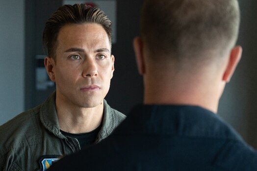  Eight-time Olympic medalist Apolo Ohno listens to a pre-flight briefing from U.S. Air Force Thunderbirds #8 Advance Pilot Maj. Jeffrey "Simmer" Downie on Peterson Space Force Base, Colorado, May 31, 2023. Ohno received a medical brief and training, was fitted for his flight suit and helmet and discussed what to expect with the pilot. (U.S. Space Force photo by Airman 1st Class Justin Todd)