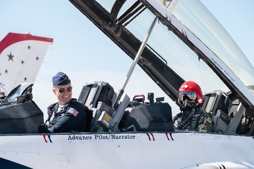  Eight-time Olympic medalist Apolo Ohno and U.S. Air Force Thunderbirds #8 Advance Pilot Maj. Jeffrey "Simmer" Downie prepare for takeoff on Peterson Space Force Base, Colorado, May 31, 2023. Before departure, Ohno received a detailed pre-flight briefing from the pilot to prepare him for the flight. (U.S. Space Force photo by Airman 1st Class Justin Todd)