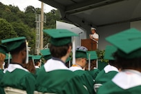 Vice Adm. Thomas E. Ishee, commander of U.S. Sixth Fleet, delivers remarks to the class of 2023 at a Naples Middle High School graduation ceremony at Carney Park in Pozzuoli, Italy, June 1, 2023.  U.S. Sixth Fleet is permanently assigned to NAVEUR-NAVAF, and employs maritime forces through the full spectrum of joint and naval operations.
