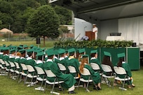 Vice Adm. Thomas E. Ishee, commander of U.S. Sixth Fleet, delivers remarks to the class of 2023 at a Naples Middle High School graduation ceremony at Carney Park in Pozzuoli, Italy, June 1, 2023. U.S. Sixth Fleet is permanently assigned to NAVEUR-NAVAF, and employs maritime forces through the full spectrum of joint and naval operations.