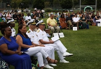 Vice Adm. Thomas E. Ishee (right), commander of U.S. Sixth Fleet and Capt. Jim Stewart, commanding officer of Naval Support Activity Naples, attend the Naples Middle/High School class of 2023 graduation ceremony at Carney Park in Pozzuoli, Italy, June 1, 2023. U.S. Sixth Fleet is permanently assigned to NAVEUR-NAVAF, and employs maritime forces through the full spectrum of joint and naval operations.