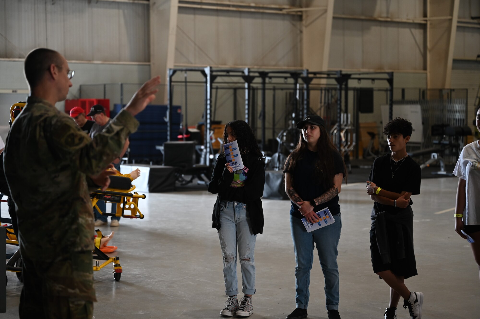 Guests listen to a briefing given by a volunteer about the importance of thermal energy and seismic activity at an open house at Goodfellow Air Force Base, Texas, June 3, 2023. Visitors toured the Louis F. Garland Department of Defense Fire Academy and learned about what it takes to train as a military firefighter and witnessed different demonstrations given by instructors and volunteers from the academy. (U.S. Air Force photo by Airman 1st Class Madison Collier)