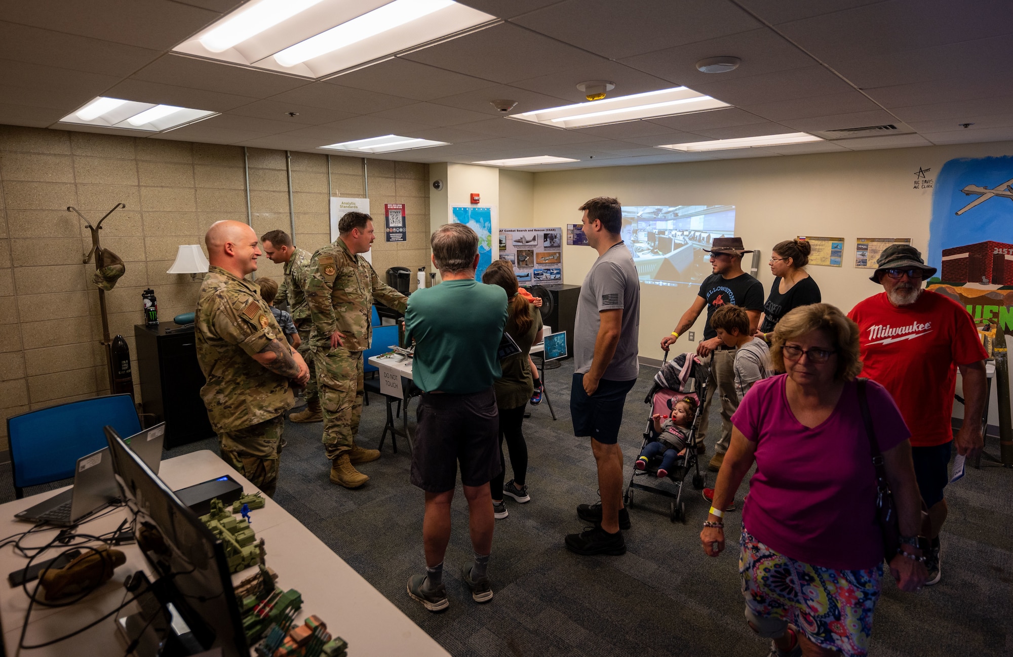 U.S. Air Force Airmen assigned to the 315th Training Squadron brief patrons during an open house at Goodfellow Air Force Base, Texas, June 3, 2023. During the event, participants were able to visit multiple locations on the base and learn about Goodfellow’s mission. (U.S. Air Force photo by Staff Sgt. Jermaine Ayers)