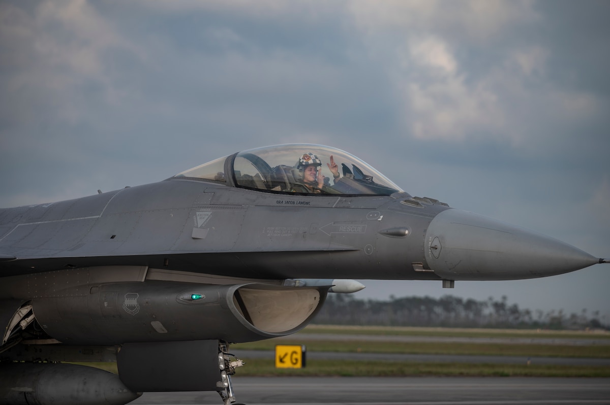 An F-16 Fighting Falcon pilot with the 55th Fighter Squadron, Shaw Air Force Base, S.C., poses for a photo during Weapons System Evaluation Program-East 23.08 at Tyndall AFB, Fla., May 17, 2023. Eligible active-duty aviators have until Sept. 15, 2023 to apply for the fiscal year 2023 Aviation Bonus Program; Air Force officials announced the Legacy Aviation Bonus Program will open June 6, 2023. (U.S. Air Force photo by Senior Airman Tiffany Del Oso)