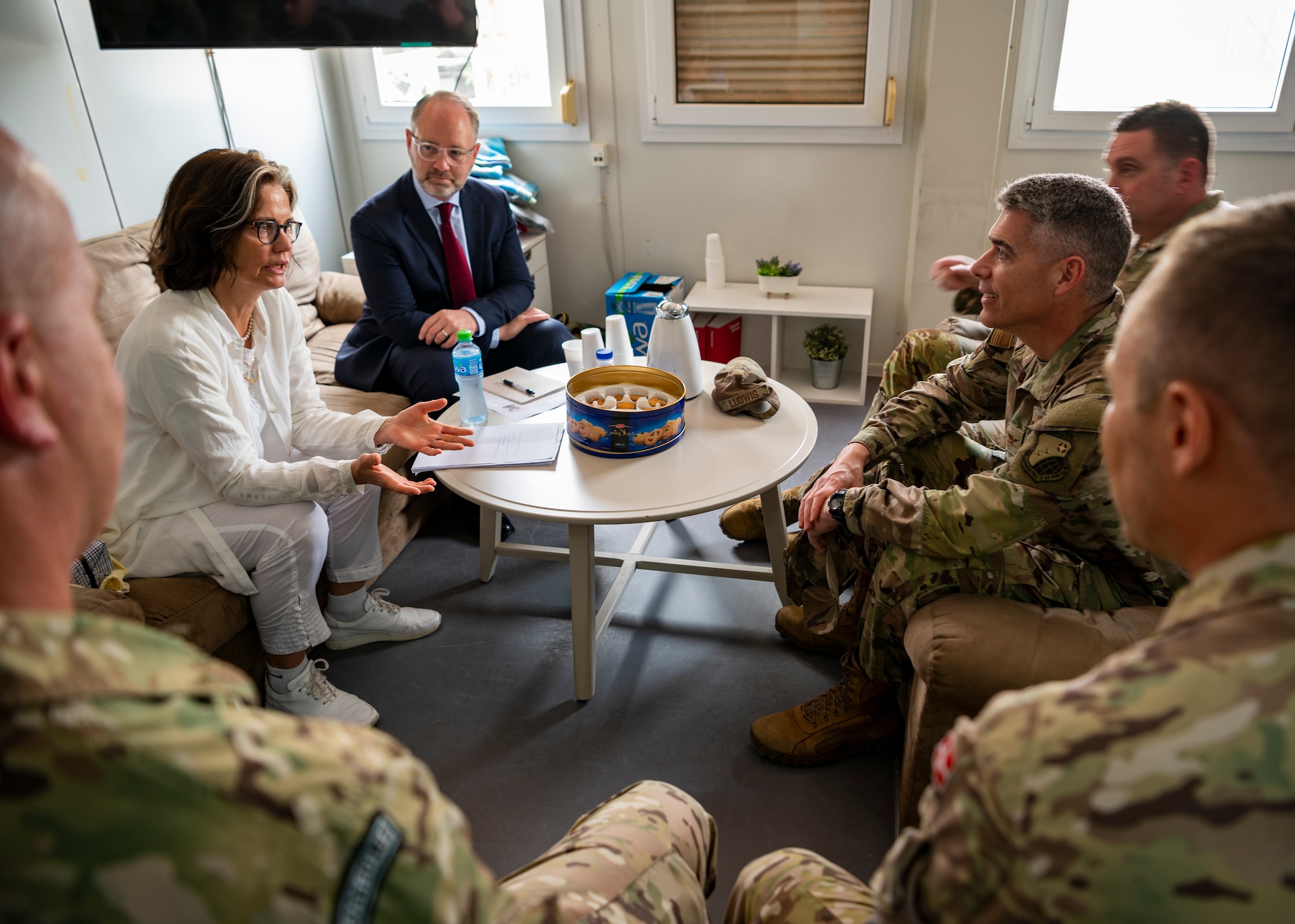 Liselotte Plesner, Ambassador of Denmark, talks with U.S. Air Force Col. George Buch, 386th Air Expeditionary Wing commander, and Chief Master Sgt. Louis Ludwig, 386th AEW command chief during a visit at Ali Al Salem Air Base, Kuwait, May 31, 2023.