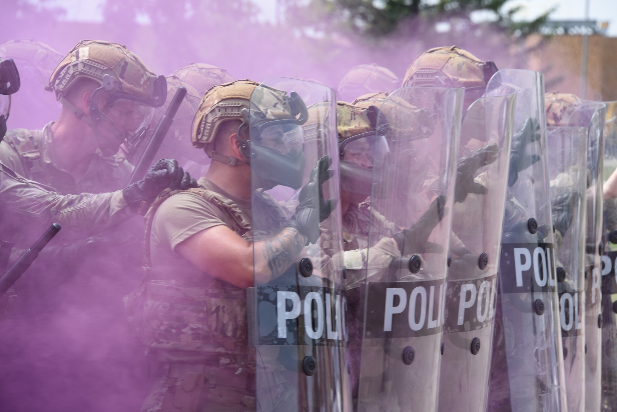 Airmen form shield wall in smoke