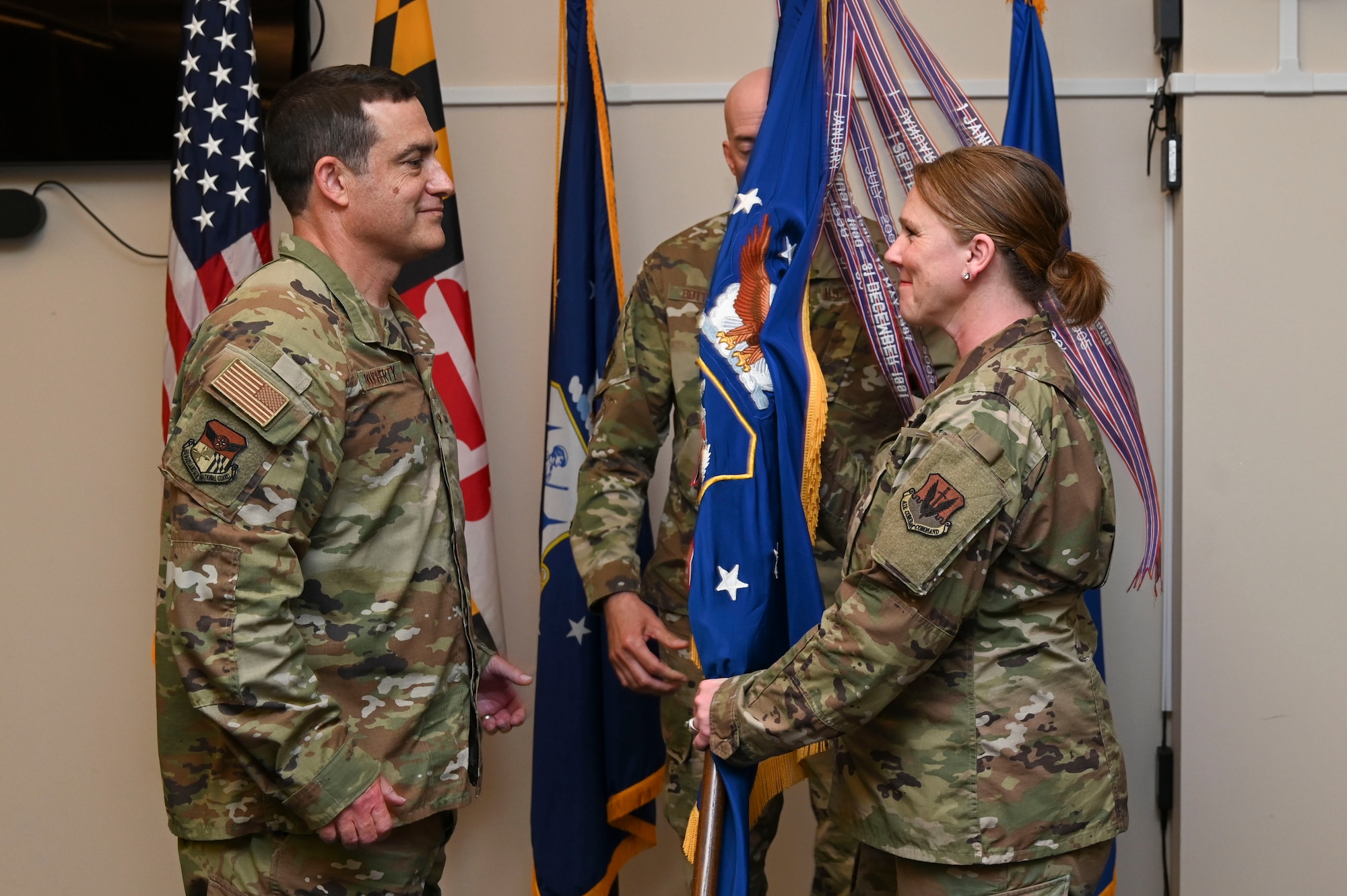 U.S. Air National Guard Brig. Gen. Jori Robinson, outgoing 175th Wing commander, passes the guidon to Brig. Gen. Drew Dougherty, assistant adjutant general - Air, during a change of command ceremony at Martin State Air National Guard Base, Middle River, Maryland, June 4, 2023.