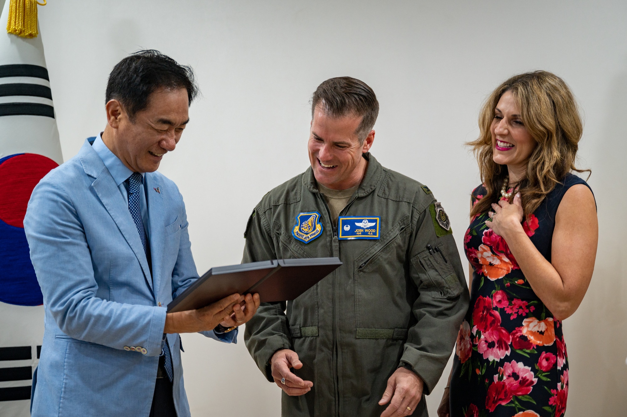 Mr. Jung, Jang Seon, left, Pyeongtaek City mayor, presents U.S. Air Force Col. Joshua Wood, middle, 51st Fighter Wing Commander, and his wife, Mrs. Bonnie Wood, with a plaque of honorary citizenship at Pyeongtaek City Hall, Republic of Korea, June 1, 2023. Osan Air Base in Pyeongtaek city fosters strong relationships among representatives from military, police, government, and civil organizations in the region. (U.S. Air Force photo by Senior Airman Thomas Sjoberg)