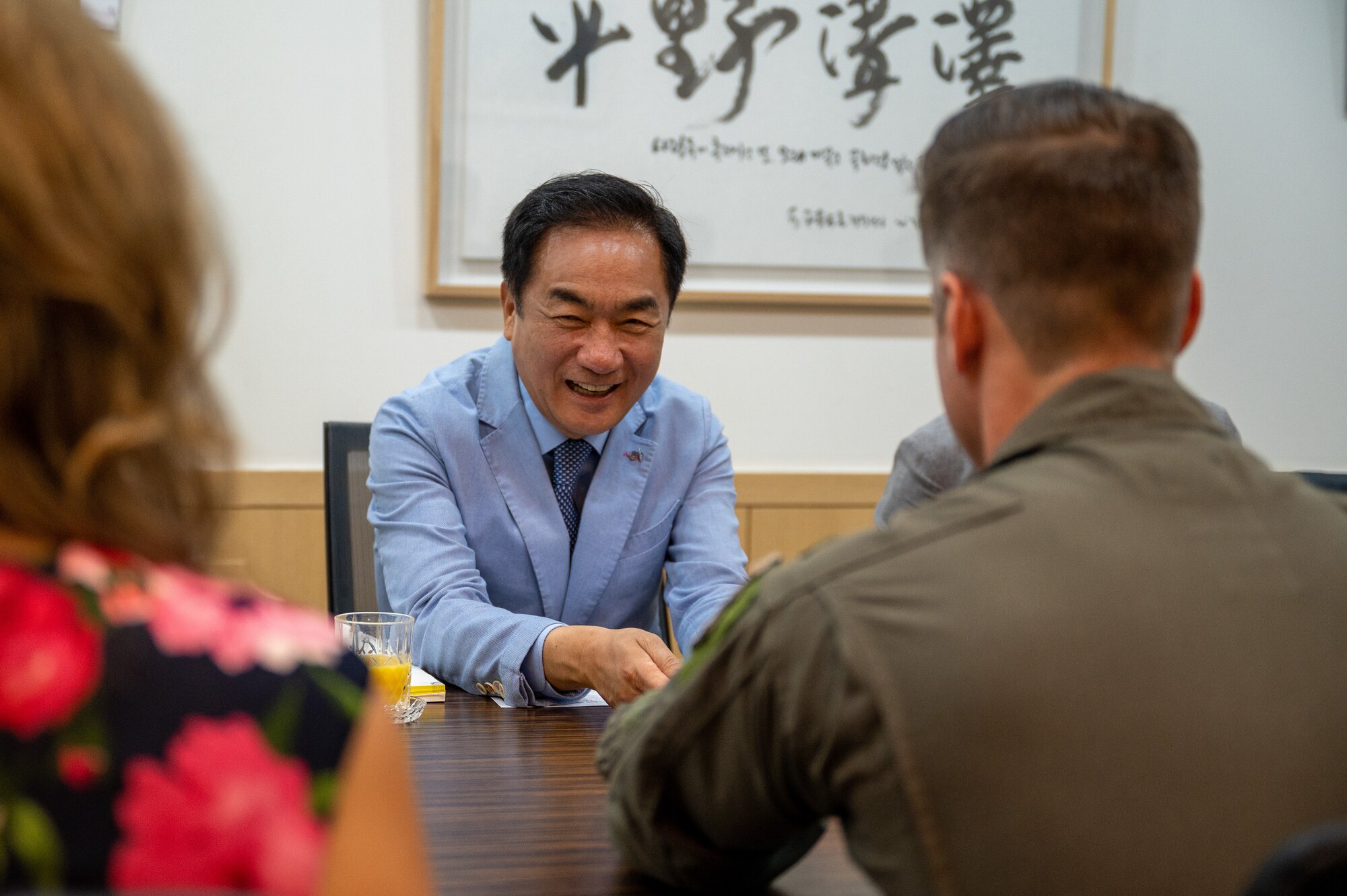 Mr. Jung, Jang Seon, laughs as he speaks with U.S. Air Force Col. Joshua Wood, 51st Fighter Wing Commander, at Pyeongtaek City Hall, Republic of Korea, June 1, 2023. Mr. Jung, Jang Seon presented Wood with a plaque of honorary citizenship. (U.S. Air Force photo by Senior Airman Thomas Sjoberg)