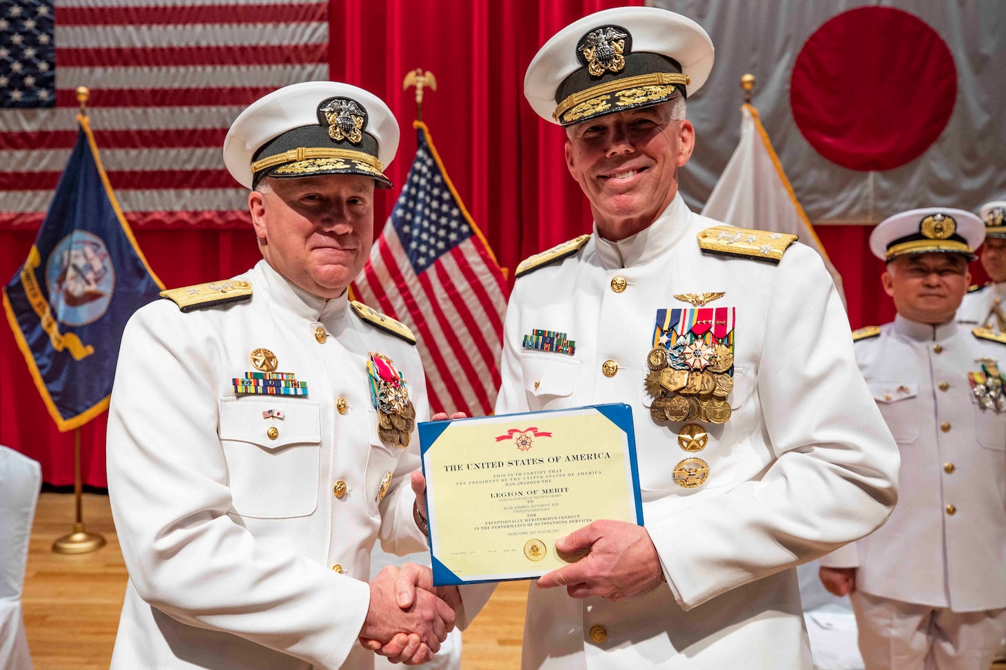 Vice Adm. Karl Thomas, commander, U.S. 7th Fleet, right, presents the Legion of Merit to Rear Adm. Rick Seif, left, outgoing commanding officer, Commander, Submarine Group 7 during a change of command ceremony at Commander, Fleet Activities Yokosuka, Japan, on June 2, 2023. Submarine Group 7 directs forward-deployed, combat capable forces across the full spectrum of undersea warfare throughout the Western Pacific, Indian Ocean, and Arabian Sea.
