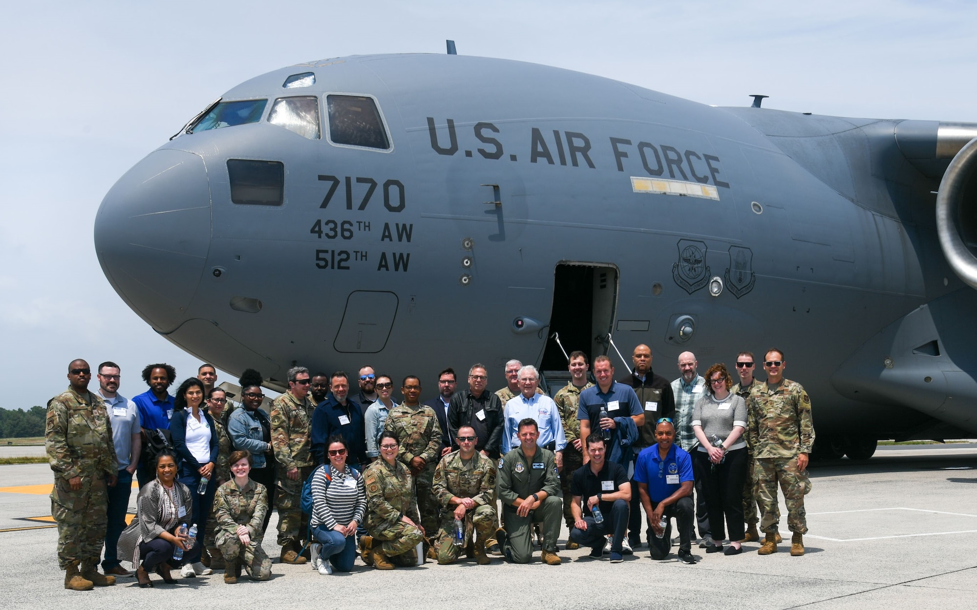 Reservists from the 512th Airlift Wing and their employers pose in front of a C-17 Globemaster III aircraft on Dover Air Force Base, Delaware, June 3, 2023. The flight, a part of the 512th AW’s Employer Day, flew passengers up and down the Delaware, Maryland, Virginia and New Jersey region. (U.S. Air Force photo by Senior Airman Shayna Hodge)