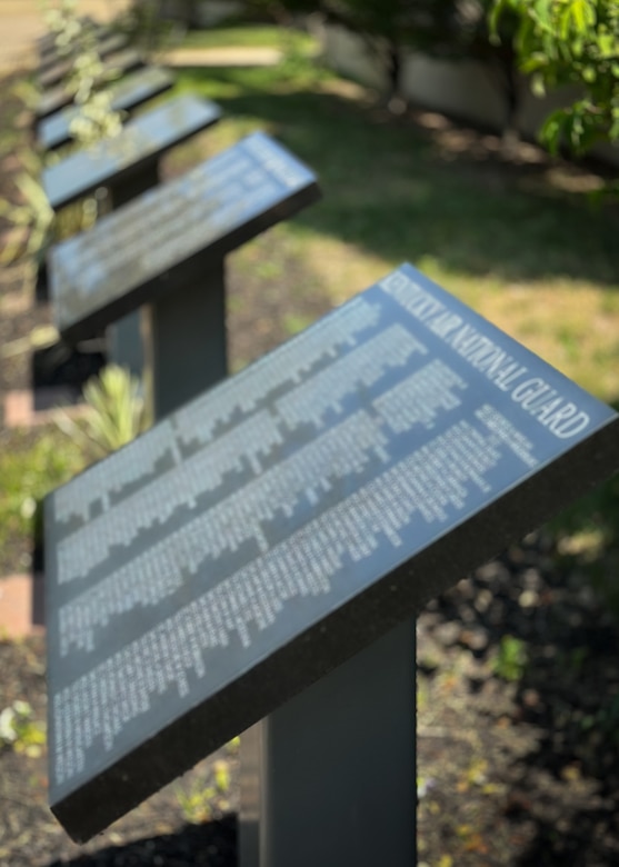 The names of 51 Airmen have been added to a monument at the Kentucky Air National Guard Base in Louisville, Ky., recognizing service members who retired from the organization in 2022. The names, inscribed on a black granite plaque in front of the 123rd Airlift Wing’s Lt. Gen. John B. Conaway Headquarters Building, were announced during a ceremony at the base April 22, 2023. (U.S. Air National Guard photo illustration by Dale Greer)