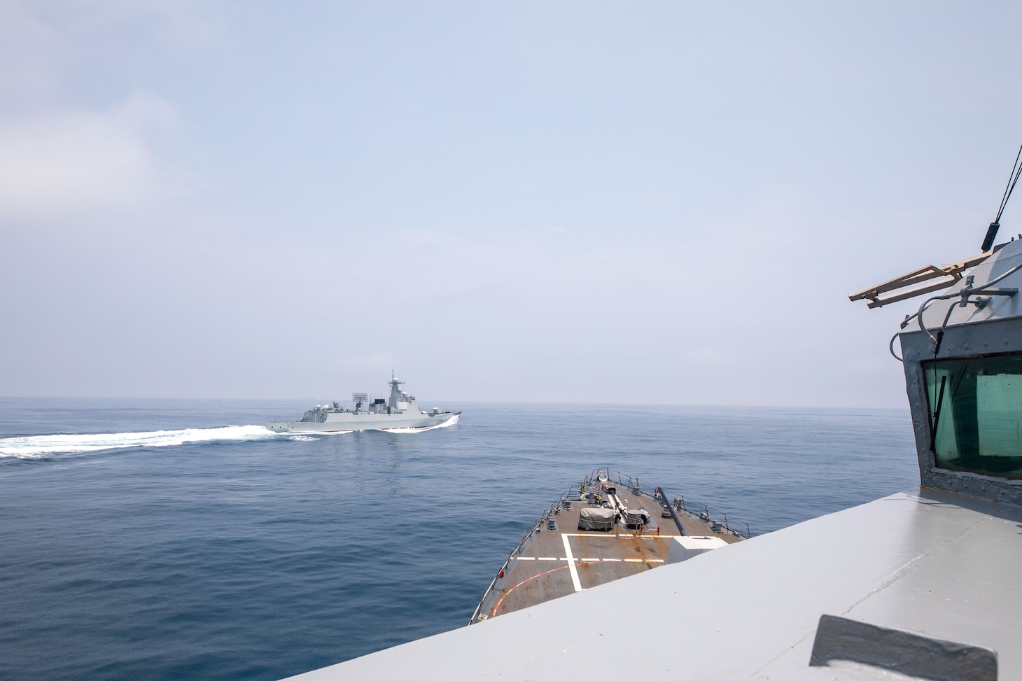 TAIWAN STRAIT (June 3, 2023) The Arleigh Burke-class guided-missile destroyer USS Chung-Hoon (DDG 93) observes PLA(N) LUYANG III DDG 132 (PRC LY 132) execute maneuvers in an unsafe manner while conducting a routine south to north Taiwan Strait transit alongside the Halifax-class frigate HMCS Montreal (FFG 336), June 3. USS Chung-Hoon is on a routine deployment to U.S. 7th Fleet and is assigned to Commander, Task Force (CTF 71)/ Destroyer Squadron (DESRON) 15. CTF 71/DESRON 15 is the largest forward-deployed DESRON and the U.S. 7th Fleet’s principal surface force. (U.S. Navy photo by Mass Communication Specialist 1st Class Andre T. Richard)