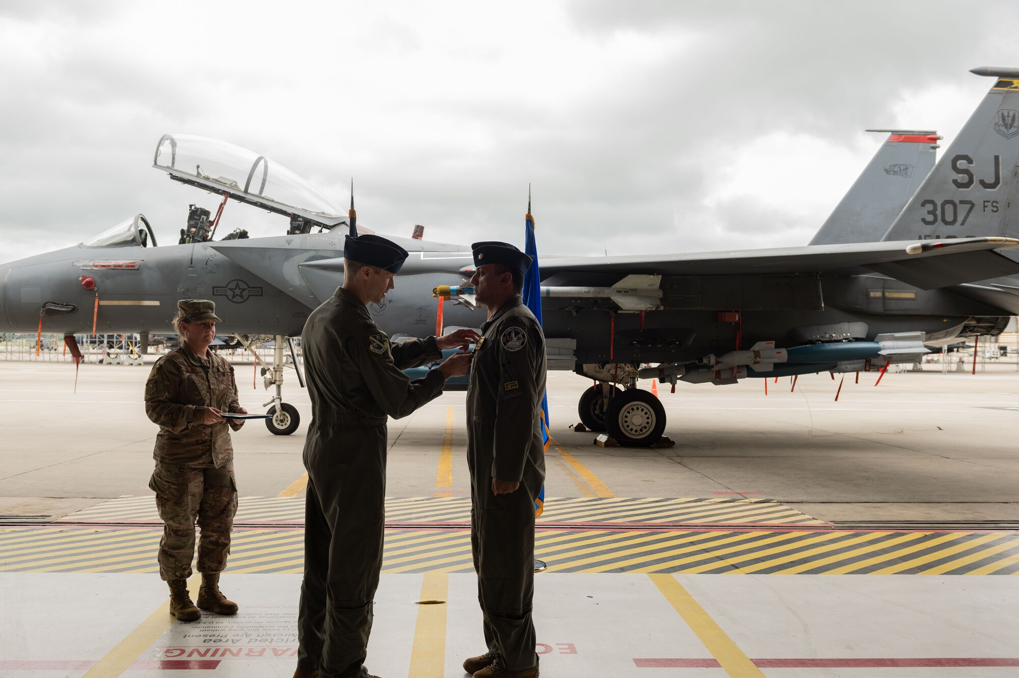 U.S. Air Force Col. Chad Shenk, 414th Fighter Squadron commander, pins the Meritorious Service Medal to Lt. Col. Sriram Krishnan, 307th Fighter Squadron commander, during a change of command ceremony at Seymour Johnson Air Force Base, North Carolina, June 2, 2023. The Meritorious Service Medal is a military award presented to members of the United States Armed Forces who distinguished themselves by outstanding service. (U.S. Air Force photo by Airman 1st Class Rebecca Sirimarco-Lang)