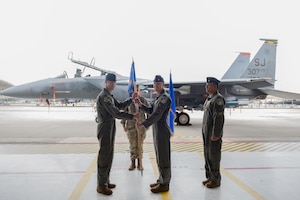 U.S. Air Force Lt Col. Andrew Blaser, incoming 307th Fighter Squadron commander, renders his first salute to the 307th FS during a change of command ceremony at Seymour Johnson Air Force Base, North Carolina, June 2, 2023. The first salute is tradition in marking the beginning of a new command. (U.S. Air Force photo by Airman 1st Class Rebecca Sirimarco-Lang)