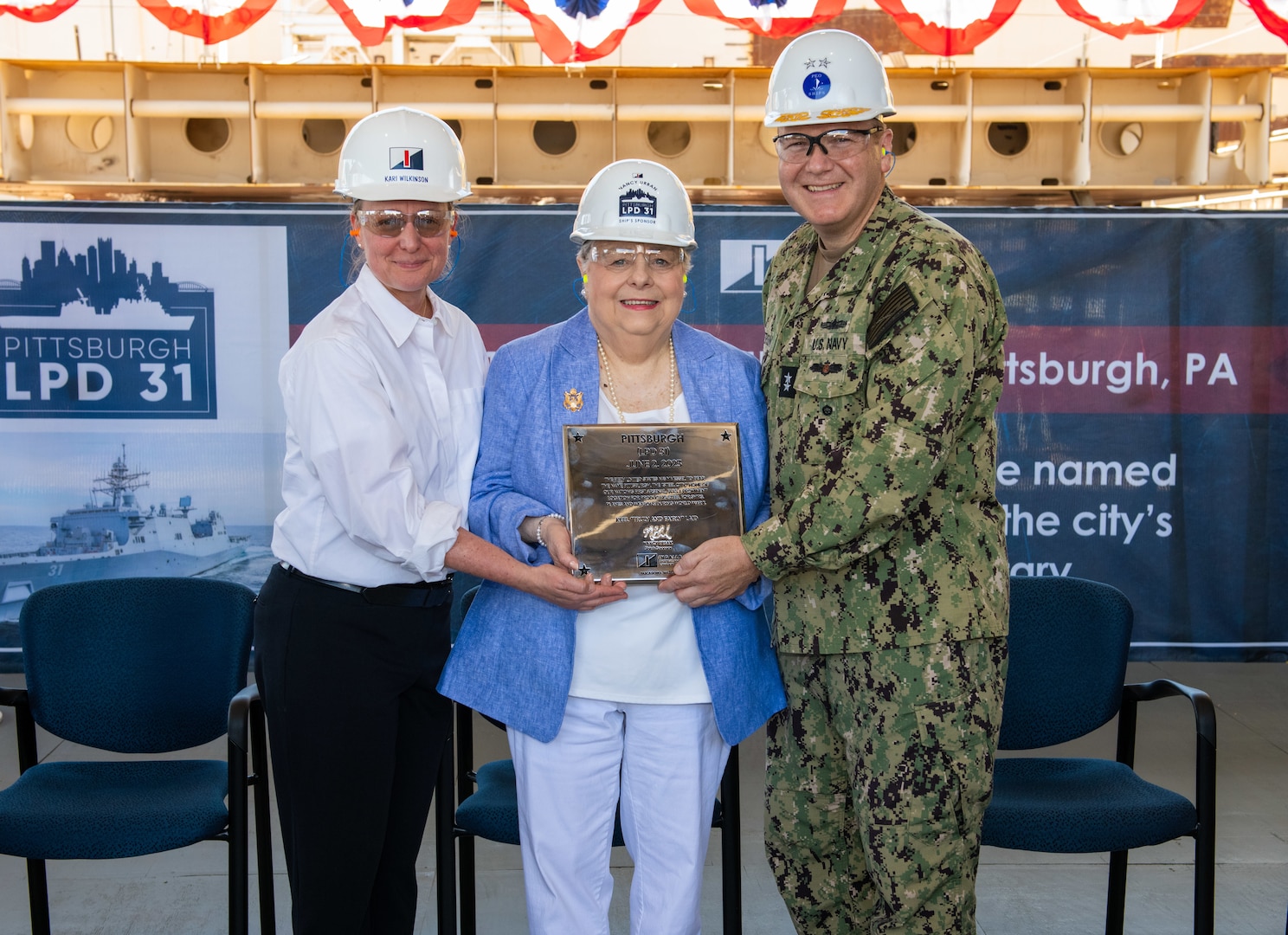 Keel Authentication ceremony of LPD 31 Pittsburgh, held at Ingalls Shipbuilding in Pascagoula, Mississippi. Pictured is Kari Wilkinson; president of Ingalls Shipbuilding, Rear Admiral Thomas J. Anderson, and ship sponsor Nancy Urban.