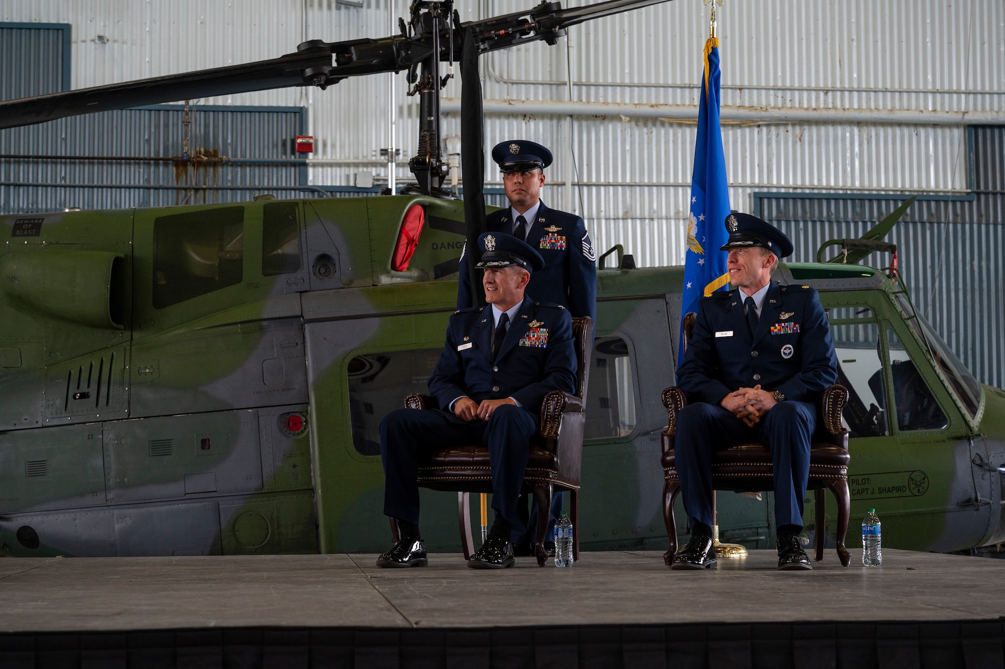 Men sitting on stage