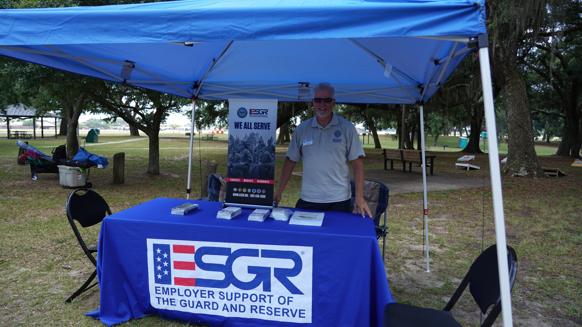 Dr. Tim Lea from the ESGR works a booth at the family day celebration.
