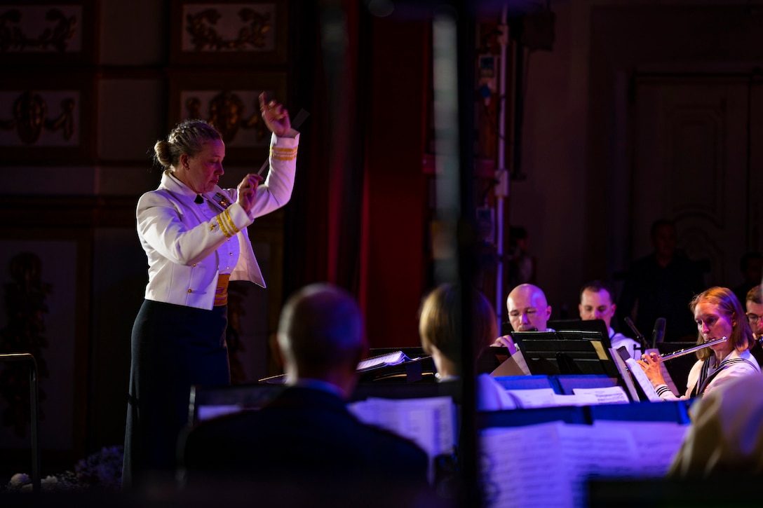 A sailor conducts an orchestra.