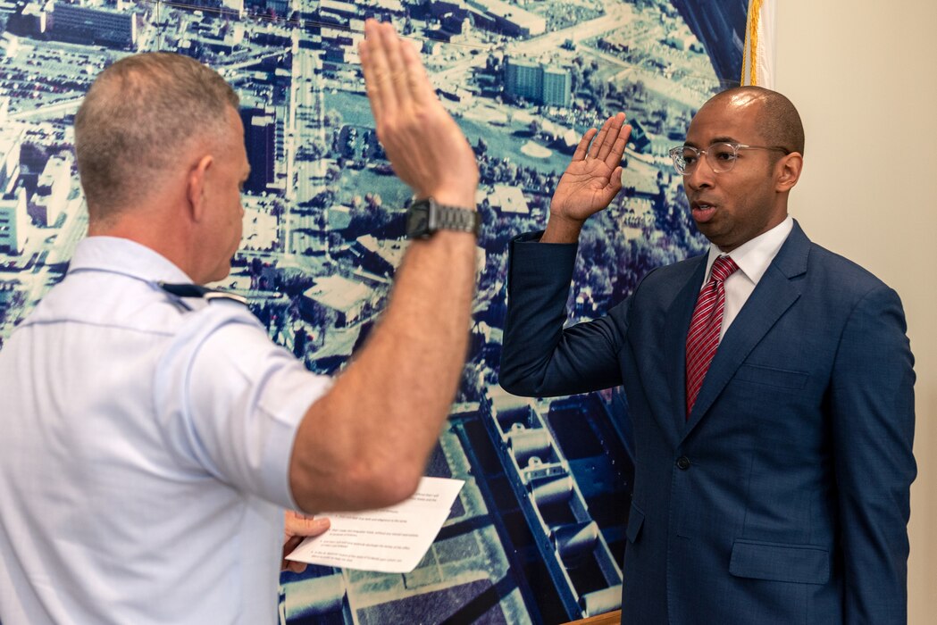 U.S. Air Force Maj. Gen. Richard Neely, left, the 40th adjutant general of the state of Illinois, and newly commissioned 1st Lt Christian Mitchell, an incoming judge advocate with the 182nd Airlift Wing, pose for a photo at Mitchell’s swearing-in in Peoria, Illinois, June 4, 2023.