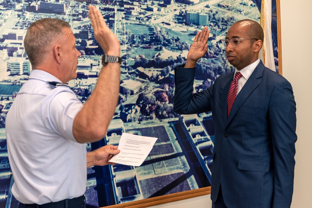 U.S. Air Force Maj. Gen. Richard Neely, left, the 40th adjutant general of the state of Illinois, and newly commissioned 1st Lt Christian Mitchell, an incoming judge advocate with the 182nd Airlift Wing, pose for a photo at Mitchell’s swearing-in in Peoria, Illinois, June 4, 2023.