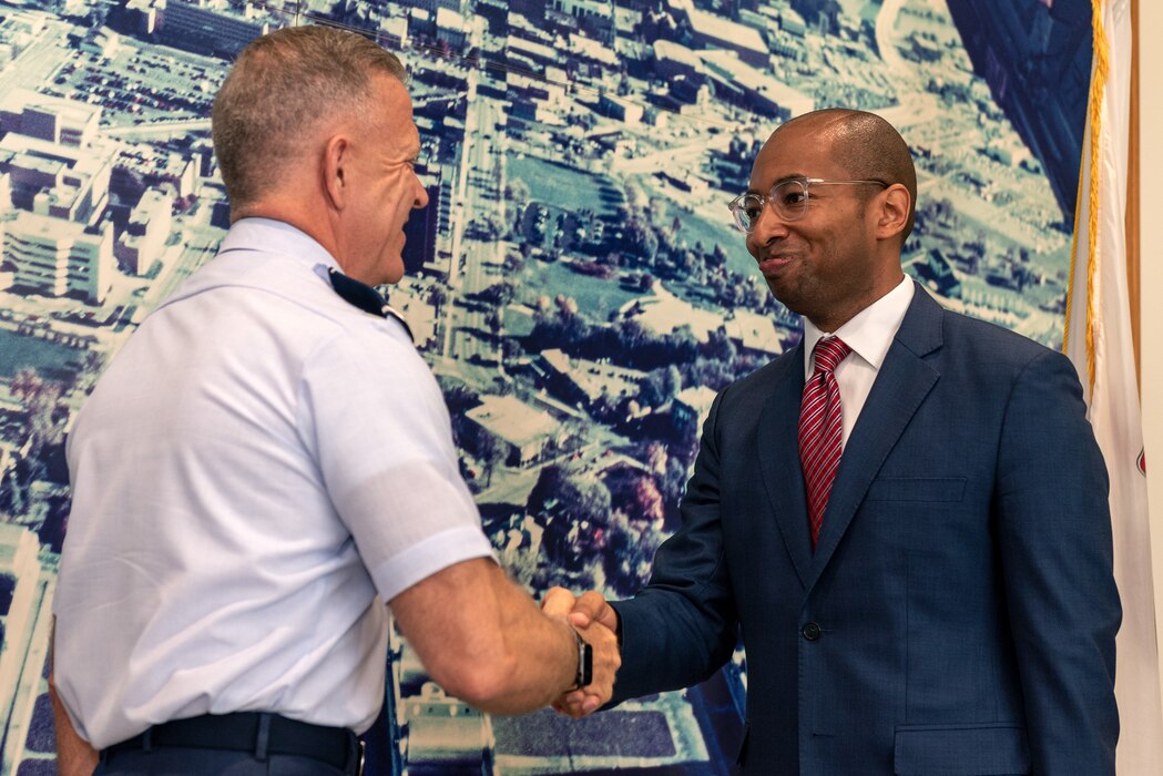 U.S. Air Force Maj. Gen. Richard Neely, left, the 40th adjutant general of the state of Illinois, and newly commissioned 1st Lt Christian Mitchell, an incoming judge advocate with the 182nd Airlift Wing, pose for a photo at Mitchell’s swearing-in in Peoria, Illinois, June 4, 2023.