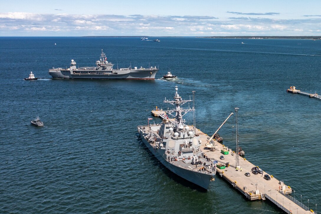 Ships move across the water.
