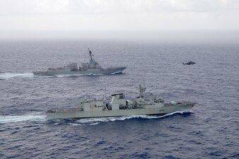 USS Chung-Hoon (DDG 93), top, and the Royal Canadian Navy frigate HMCS Montreal (FFG 336) transit the South China Sea during exercise Noble Wolverine.