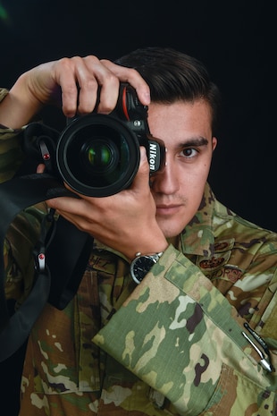 U.S. Air Force Staff Sgt. Shaei Rodriguez, 9th Reconnaissance Wing public affairs specialist, poses with a camera June 01, 2023, at Beale Air Force Base, Calif.