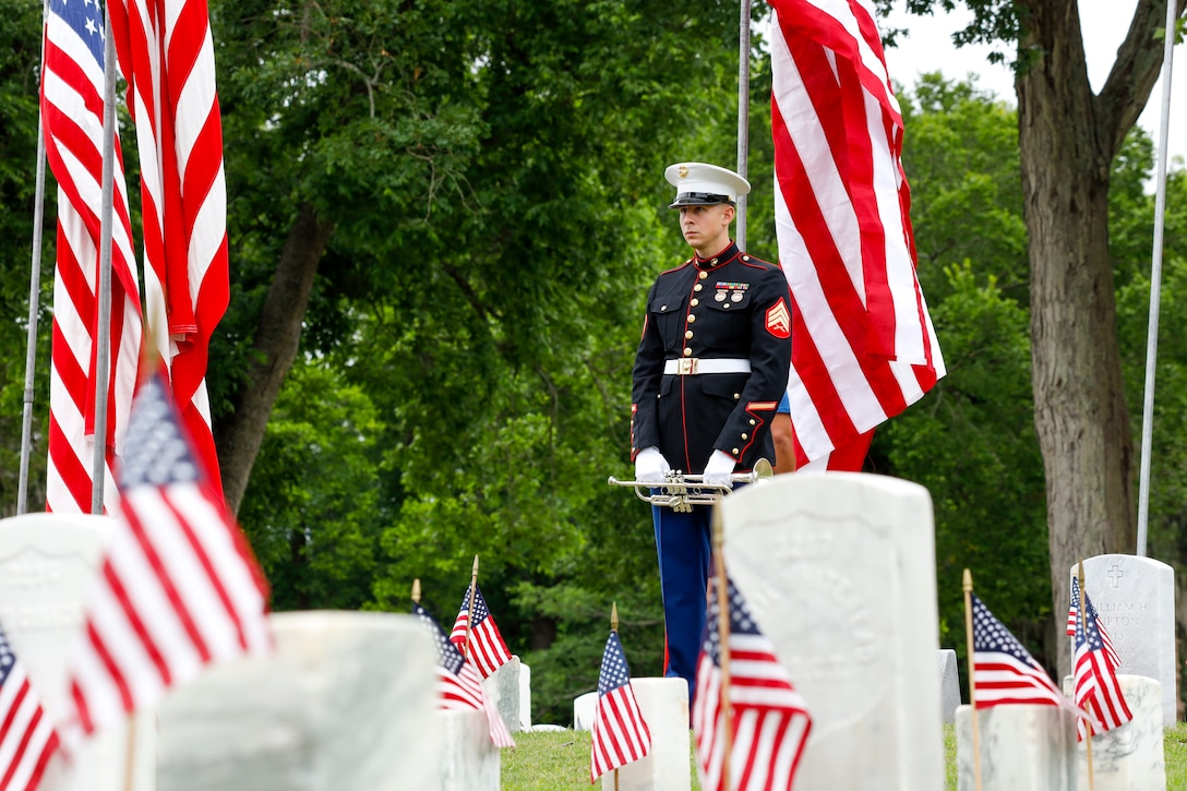 U.S. Marine Corps Sgt. Taylor Brown, a musician with the 2nd Marine Aircraft Wing Band, holds his post during the New Bern National Cemetery Memorial Day ceremony at New Bern, North Carolina, May 29, 2023. Memorial Day has been a time-honored, annual tradition since its inception in 1868, by Union Army Brig. Gen John Logan, to honor and remember those who sacrificed their lives in defense of our nation. (U.S. Marine Corps photo by Cpl. Noah Braswell)