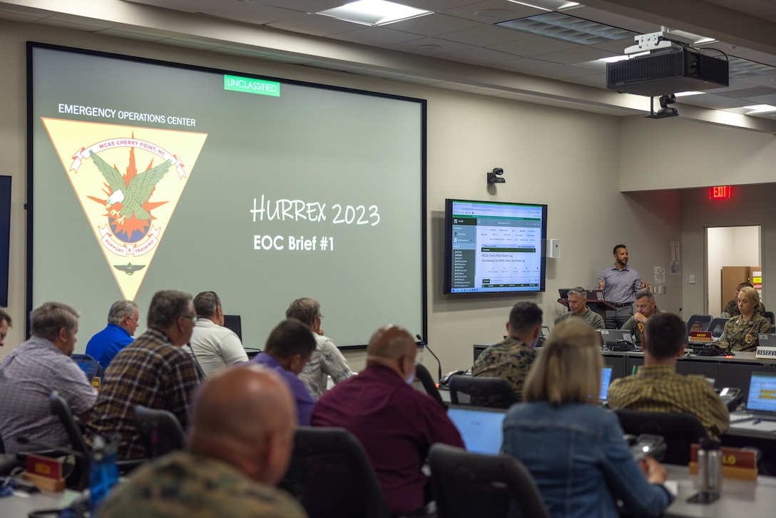 Grant DeHaven, director of mission assurance, briefs key installation leaders on the week-long Hurricane Exercise (HURREX) 2023, Marine Corps Air Station (MCAS) Cherry Point, North Carolina, May 15, 2023. MCAS Cherry Point tested multiple scenarios during HURREX 2023, a week-long preparation exercise to test the air station’s ability and response time of various aspects to endure a destructive storm. (U.S. Marine Corps photo by Lance Cpl. Lauralle Walker)