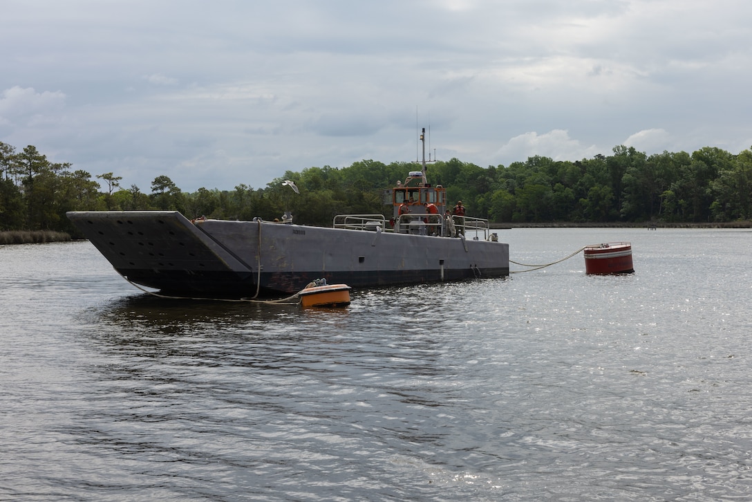 A barge is tied off to two buoys during a hurricane readiness exercise on MCAS Cherry Point, North Carolina, May 16, 2023. MCAS Cherry Point tested multiple scenarios during HURREX 2023, a week-long preparation exercise to test the air station’s ability and response time of various aspects to endure a destructive storm. (U.S. Marine Corps photo by Cpl. Jade Farrington)