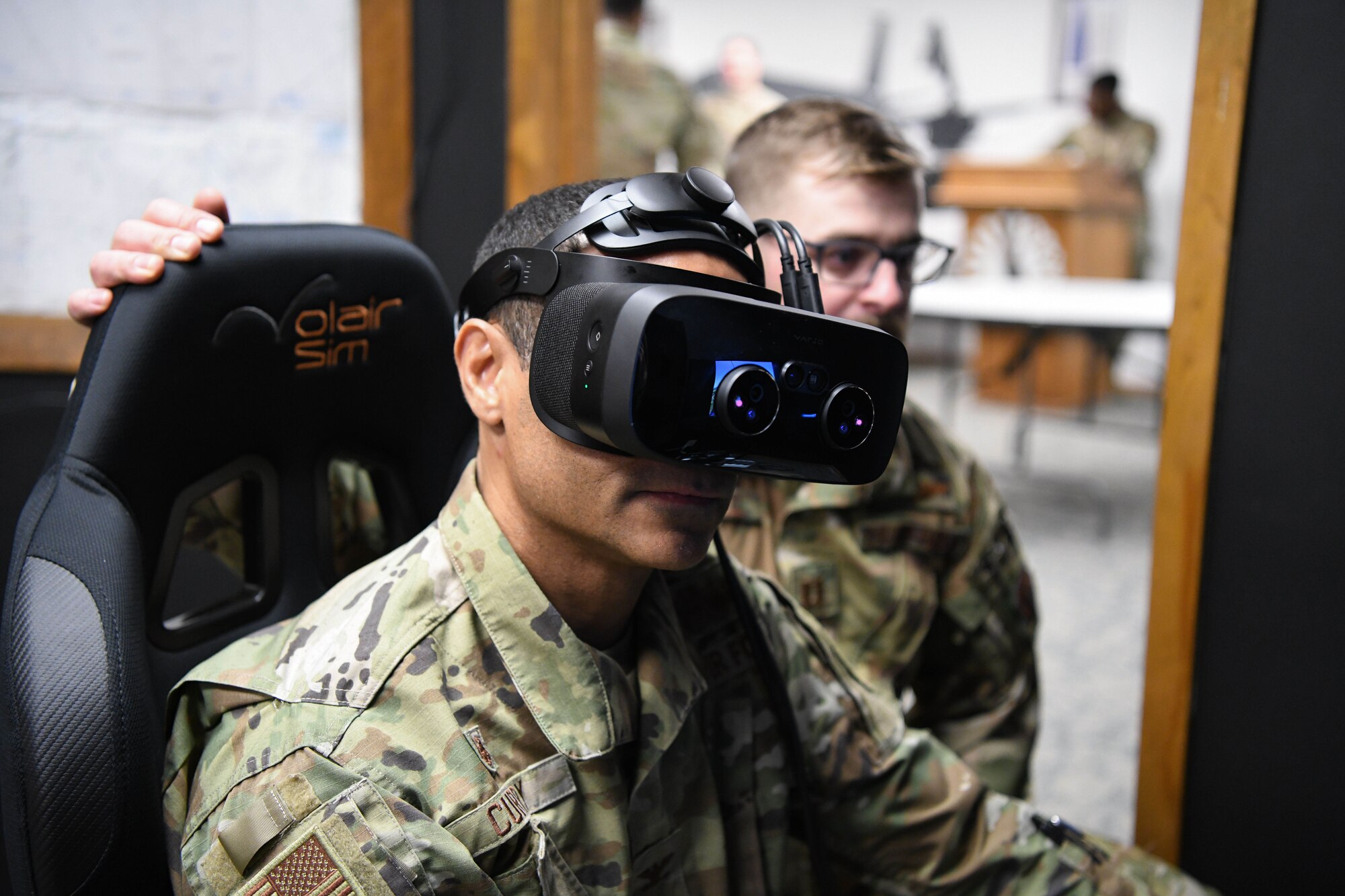 Man in military uniform wears virtual reality headset