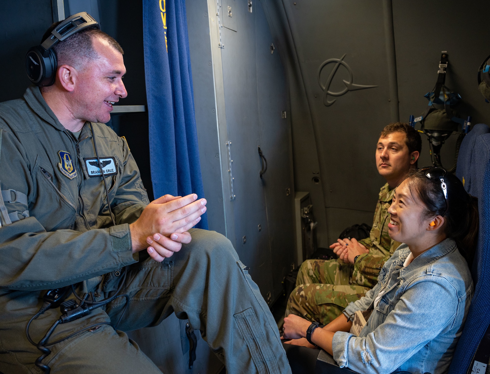 Capt. Brandon Cruz, left, 326th Airlift Squadron pilot, converses with Tina Cooper, an Employer Support of the Guard and Reserve member, before an incentive flight on a C-17 Globemaster III at Dover Air Force Base, Delaware, June 3, 2023. ESGR, a Department of Defense office, was established in 1972 to promote cooperation and understanding between Reserve Component Service members and their civilian employers and to assist in resolving conflicts arising from an employee's military commitment. (U.S. Air Force photo by Airman 1st Class Amanda Jett)