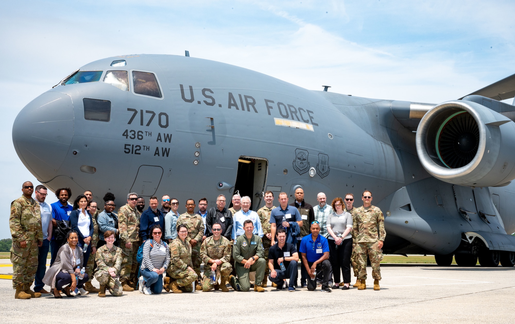 Employer Support of the Guard and Reserve members and 512th Airlift Wing Airmen pose for a group photo in front of a C-17 Globemaster III at Dover Air Force Base, Delaware, June 3, 2023. ESGR, a Department of Defense office, was established in 1972 to promote cooperation and understanding between Reserve Component Service members and their civilian employers and to assist in resolving conflicts arising from an employee's military commitment. (U.S. Air Force photo by Airman 1st Class Amanda Jett)