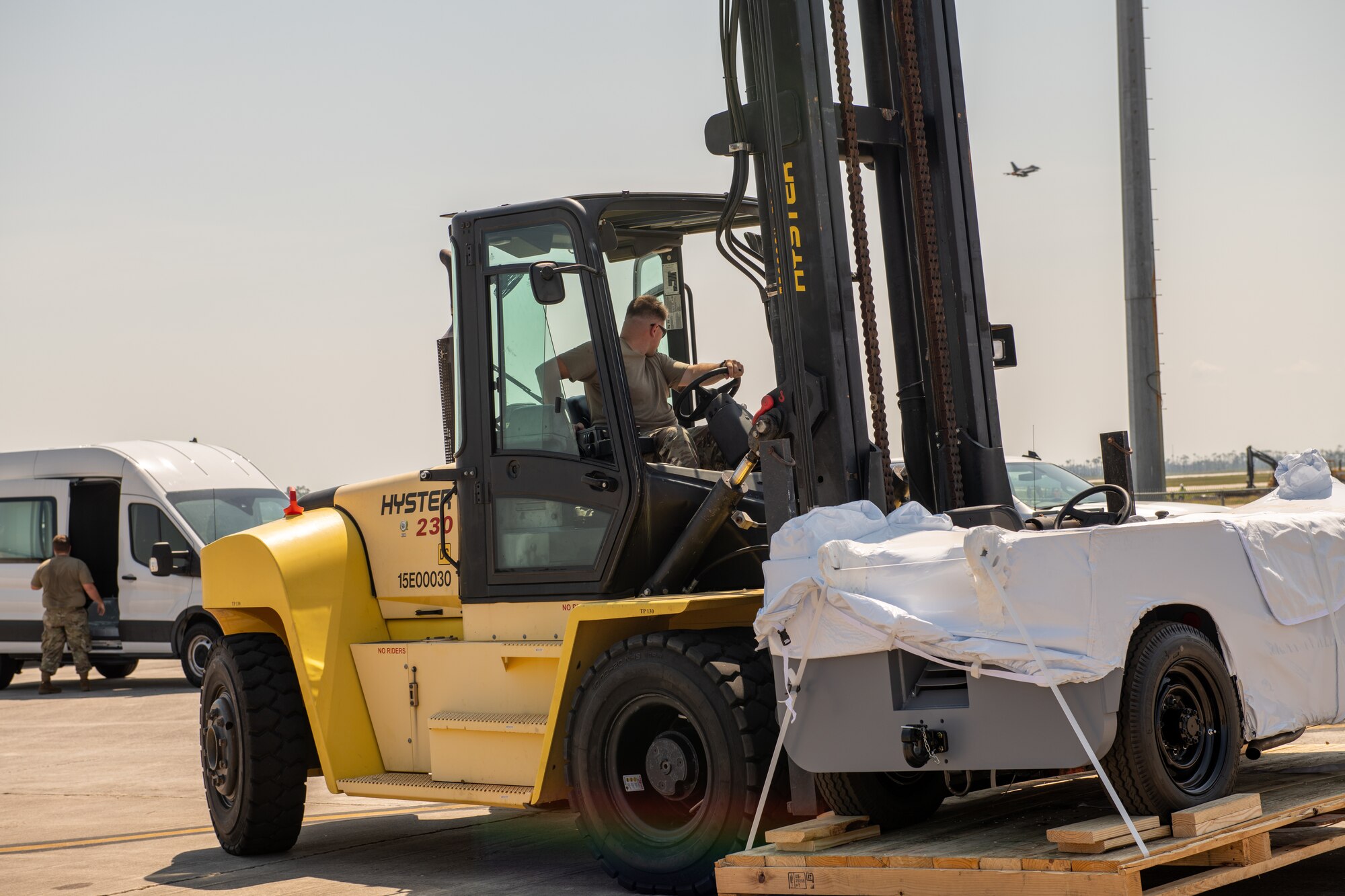 Airmen moves F-35 equipment with a forklift
