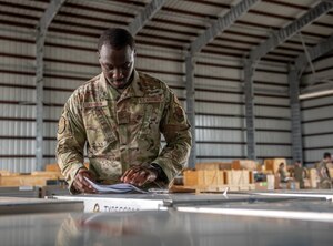 Airmen examines paper work