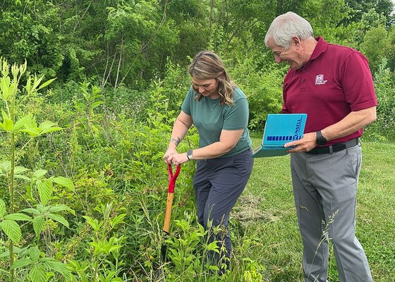 Regulatory Specialist Mary Ann Brannan and Regulatory Specialist Ken Jones collect soil samples June 1, 2023, to help identify potential wetlands in Lenoir City, Tennessee.