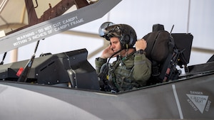 U.S. Air Force Lt. Col. Adam Vogel, 310th Fighter Squadron commander, gives remarks at the 310th FS assumption of command ceremony June 2, 2023, at Luke Air Force Base, Arizona.