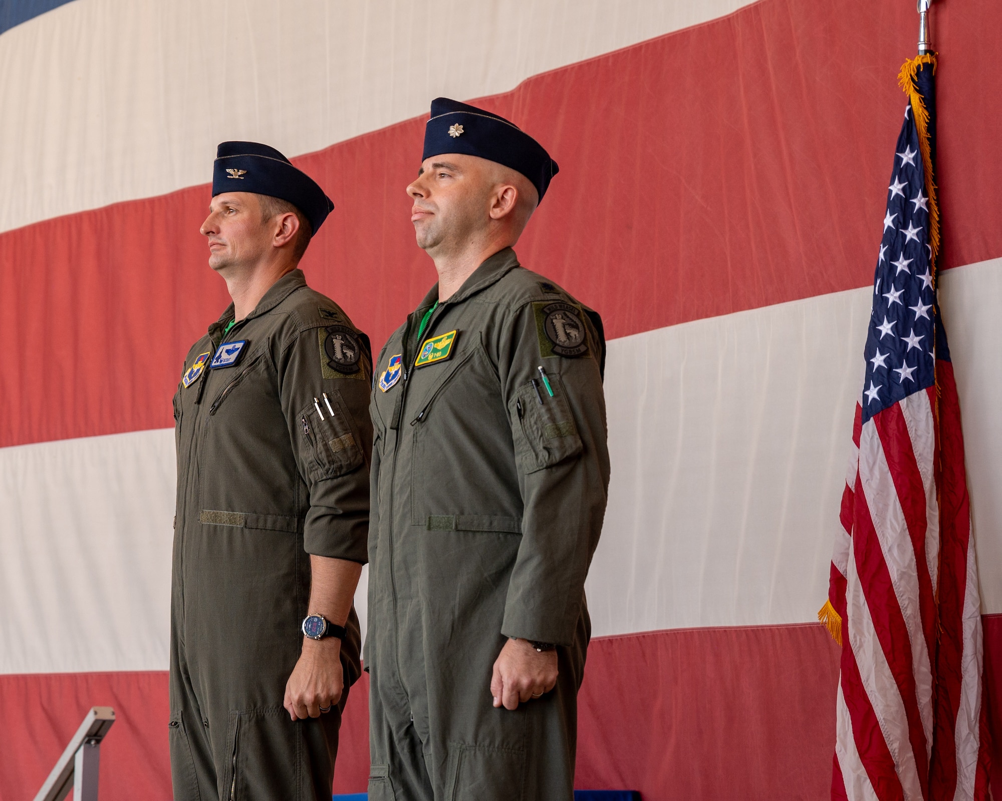 U.S. Air Force Col. Matthew Johnston (left), 56th Operations Group commander, stands by U.S. Air Force Lt. Col. Adam Vogel (right), 310th Fighter Squadron commander, at an assumption of command ceremony June 2, 2023, at Luke Air Force Base, Arizona.