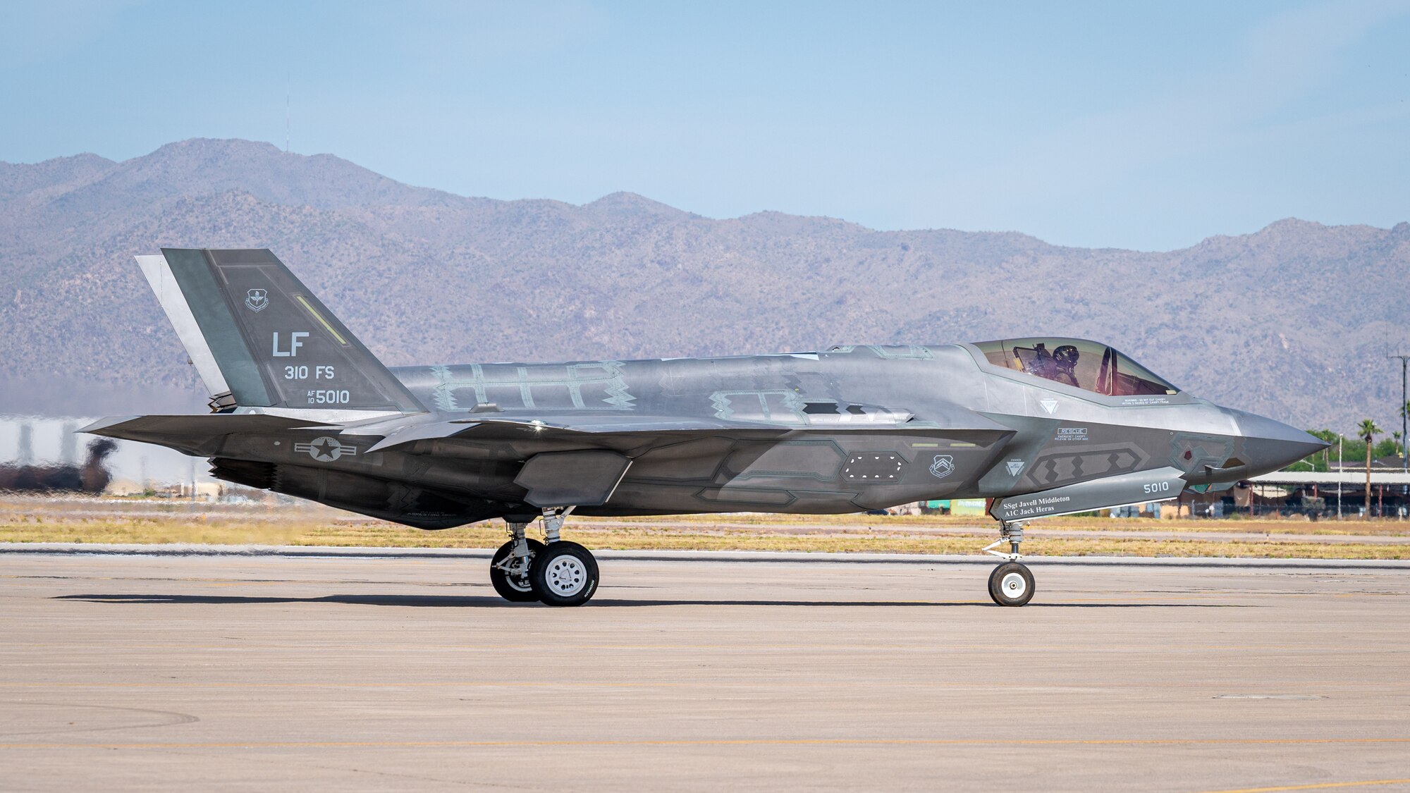 U.S. Air Force Lt. Col. Adam Vogel (left), 310th Fighter Squadron commander, taxis an F-35 Lightning II to the runway June 5, 2023, at Luke Air Force Base, Arizona.