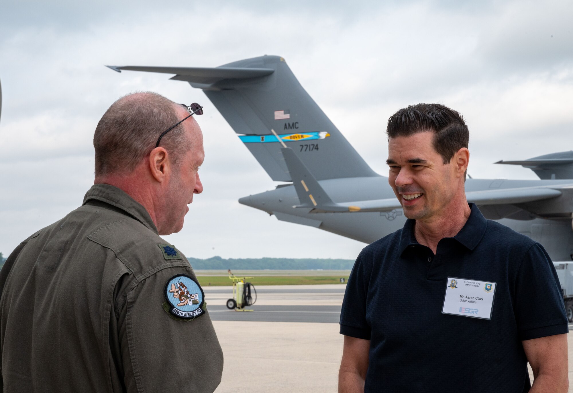 Lt. Col. John Daly, left, 326th Airlift Squadron pilot, converses with Aaron Clark, right, an Employer Support of the Guard and Reserve member, before an incentive flight on a C-17 Globemaster III at Dover Air Force Base, Delaware, June 3, 2023. ESGR, a Department of Defense office, was established in 1972 to promote cooperation and understanding between Reserve Component Service members and their civilian employers and to assist in resolving conflicts arising from an employee's military commitment. (U.S. Air Force photo by Airman 1st Class Amanda Jett)