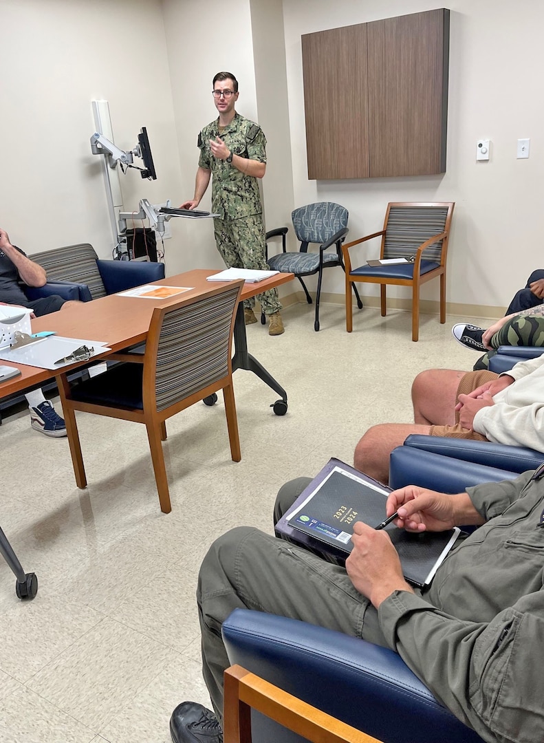 Lt. Alex Kirk, clinical psychologist at Naval Hospital Jacksonville’s Behavioral Health Clinic, leads an insomnia class, which is part of the new Defense Health Agency’s Targeted Care Pilot Program. The program uses a new approach to mental health, including the use of groups. (U.S. Navy official photo by Deidra Smith, Naval Hospital Jacksonville/Released)