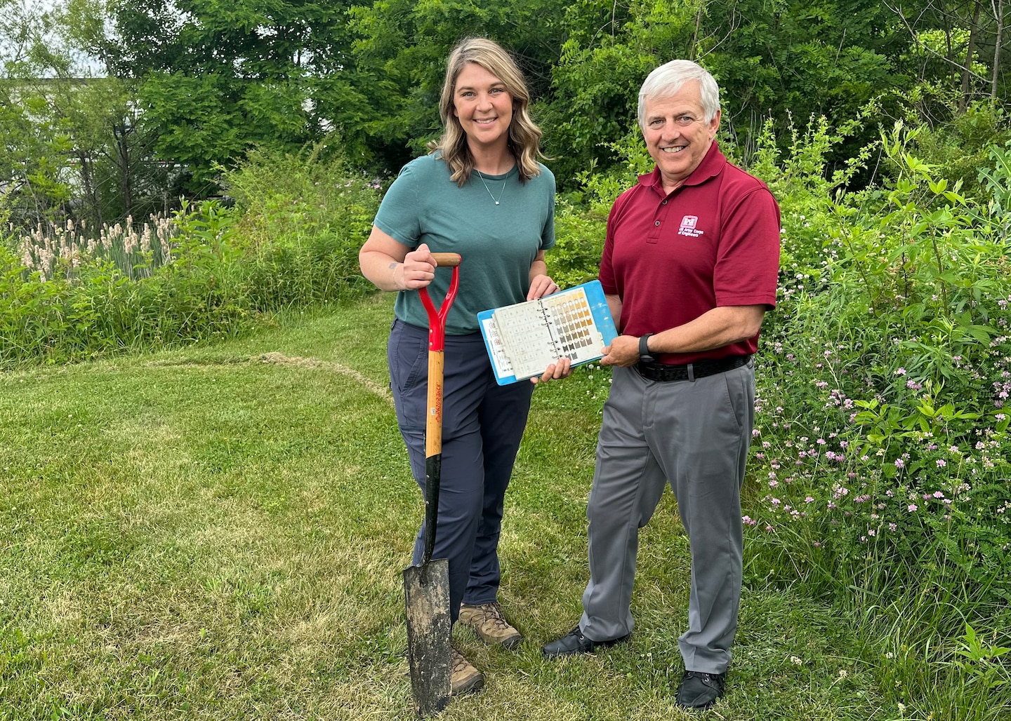 Regulatory Specialist Mary Ann Brannan and Regulatory Specialist Ken Jones use a sharpshooter tool to collect soil samples June 1, 2023, to help identify potential wetlands in Lenoir City, Tennessee.