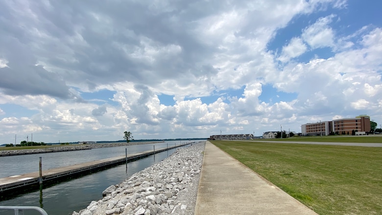 Riprap is pictured on the shoreline of a body of water.