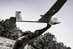 Sgt. Byme Taylor, 1st Battalion, 175th Infantry Regiment infantryman, launches an RQ-11 Raven at Joint Base McGuire-Dix-Lakehurst in New Jersey June 1, 2023. With a flight radius of 6.2 miles and the ability to reach speeds of 31 to 62 mph, the Raven provides better aerial reconnaissance than most drones.